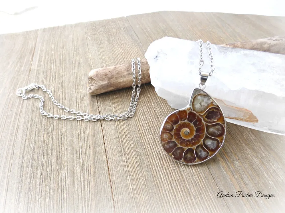 Ammonite shell stone silver frame pendant with silver chain necklace.